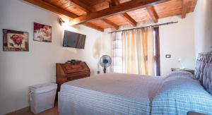 Postel nebo postele na pokoji v ubytování Casa Vacanze " IS MERIS "