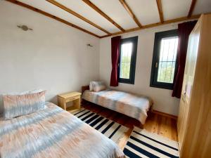 Postel nebo postele na pokoji v ubytování Lamin House
