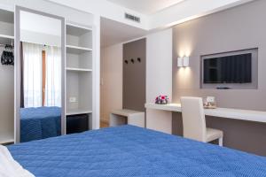 Voodi või voodid majutusasutuse Hotel Martino toas
