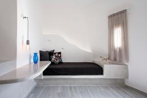 Letto o letti in una camera di TheArtemis Perissa