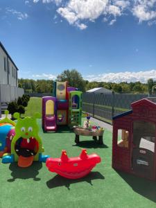 a playground with many different types of play equipment at Sofia Pokoje z łazienką i aneksem kuchennym in Jarosławiec
