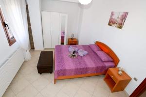 Posteľ alebo postele v izbe v ubytovaní Martha Apartment