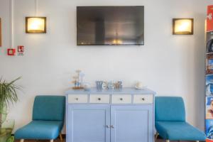 TV a/nebo společenská místnost v ubytování Hotel Belmar
