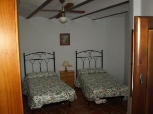 מיטה או מיטות בחדר ב-Alojamiento Rural Las Zagalas