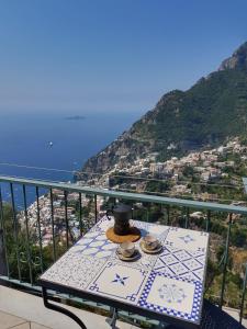 a table that has a plate of food on it at Casa TerryB - il Monticello in Positano