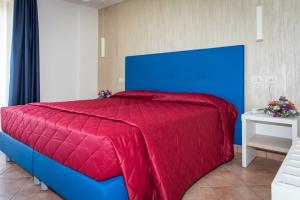 Voodi või voodid majutusasutuse Hotel Martino toas