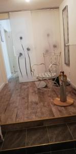 a room with drawings of flowers on the wall at Landhaus Löwenzahn in Dornum +47 photos