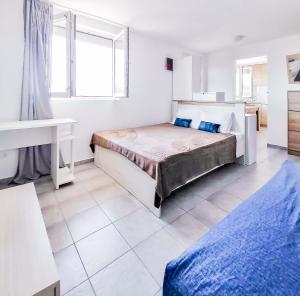Postel nebo postele na pokoji v ubytování Apartments Siesta