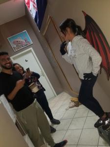 a group of people standing in a room at Hurricane Hostel in Split