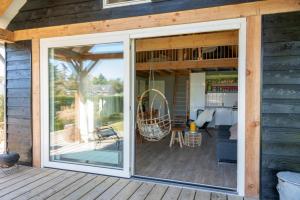 a screened in porch with a sliding glass door at Sunny Medemblik in Medemblik