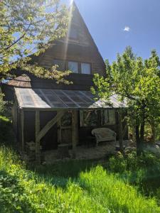 a house with a solar panel on the roof at Pokoje u Agnieszki in Dwernik +1 photo