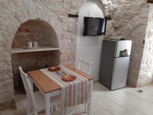 Kuchyň nebo kuchyňský kout v ubytování Trulli Resort Grassi