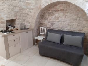 Kuchyň nebo kuchyňský kout v ubytování Trulli Resort Grassi