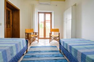 A bed or beds in a room at Sunset Alghero