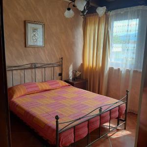 Postel nebo postele na pokoji v ubytování Villa Pinella