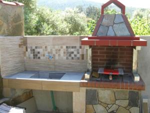 a model of a kitchen with a brick oven at AGERI STUDIOS in Skala Kallirakhis