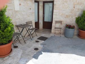 Patio nebo venkovní prostory v ubytování Trulli Resort Grassi