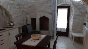 Kuchyň nebo kuchyňský kout v ubytování Trulli Resort Grassi