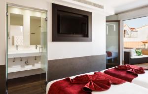 a hotel room with two sinks and a large mirror at Francisco I Boutique in Madrid