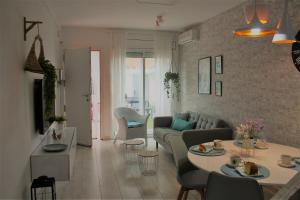 a living room with a couch and a table at Vila LYDIA in Cambrils