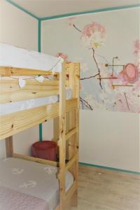 a room with two bunk beds and a painting on the wall at Vila LYDIA in Cambrils