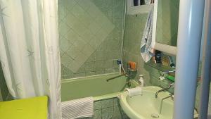a bathroom with a sink and a tub and a shower at Blue room. Lviv squre. in Kyiv
