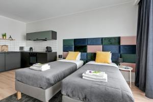 Posteľ alebo postele v izbe v ubytovaní Apartament Wałowa Stara Stocznia Gdańsk