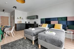 Kuchyňa alebo kuchynka v ubytovaní Apartament Wałowa Stara Stocznia Gdańsk
