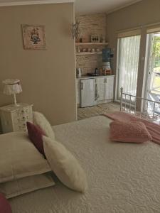 a bedroom with a large bed with two pillows on it at Holiday Home Kolka in Kolka