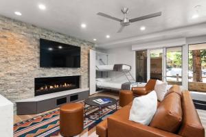 a living room with a couch and a fireplace at Little Nell Condo #3 in Aspen