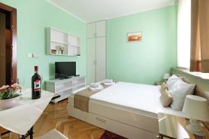 En TV eller et underholdningssystem på Apartments Bohemia
