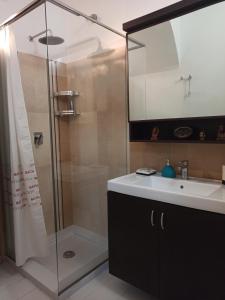 a bathroom with a sink and a shower at Da Sepideh in Gaeta +24 photos