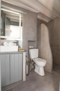 a bathroom with a toilet and a sink at Alessios Houses Mykonos Town in Mýkonos City +15 photos