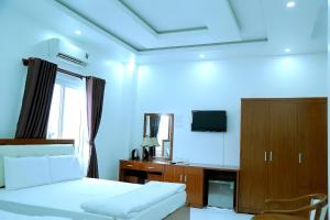 TV a/nebo společenská místnost v ubytování HOTEL ĐĂNG KHOA 1 NÚI SAM + 28 fotografií