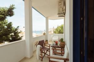 a balcony with a view of the ocean at Sunset Home Crete in Paránimfoi