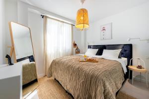 A bed or beds in a room at Bella Casa Eta