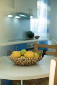 a bowl of fruit on a table in a kitchen at Sunset Home Crete in Paránimfoi