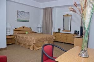 Postel nebo postele na pokoji v ubytování Hotel Chacao Cumberland
