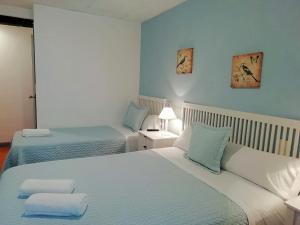 A bed or beds in a room at Pension Kaia