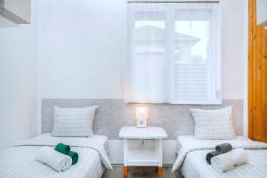 A bed or beds in a room at Green Stone Apartments