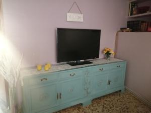 a television on top of a dresser in a room at Ca la Glori in Los Corrales