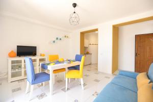a living room with a table and chairs at Casa Floriana Seaview in Capri