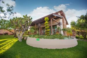 a house with a garden in front of it at Casa Legado in Aguascalientes