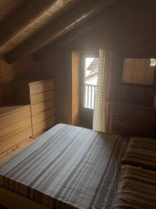 Кровать или кровати в номере Les Chambrettes