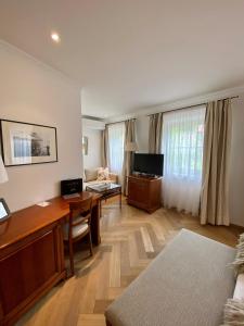 TV a/nebo společenská místnost v ubytování Boutique Hotel Aichinger