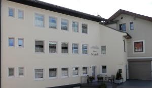 a white building with a lot of windows at Haus Schmidt in Berchtesgaden