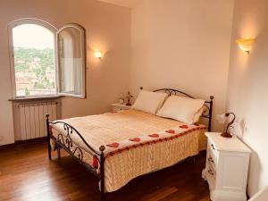 a bedroom with a bed with a large window at Finestra tra le Stelle in Arcola