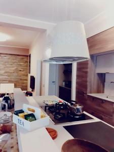 a kitchen with a stove top oven in a kitchen at Belo Horizonte in Civitanova Marche