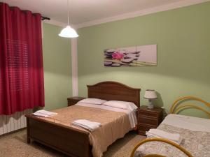 Postel nebo postele na pokoji v ubytování Casa Delle Mura + 43 fotografií
