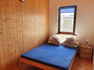 Katil atau katil-katil dalam bilik di Apartamenty pod lipą